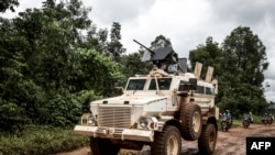 A military truck of the United Nations Organisation and Stabilisation Mission in the Democratic Republic of the Congo patrols on the road linking Beni to Mangina on Aug. 23, 2018 in Beni, in the DRC's North Kivu province.