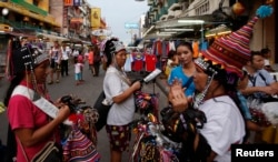 Vendors sell trinkets in a tourist district of Khao San Road in Bangkok, May 27, 2014.