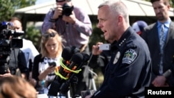 Police chief Brian Manley speaks during a news conference near the scene where a woman was injured in a package bomb explosion in Austin, Texas, March 12, 2018.