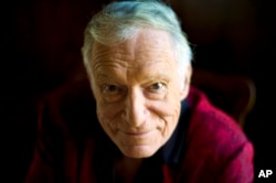 FILE - American magazine publisher, founder and Chief Creative Officer of Playboy Enterprises, Hugh Hefner at his home at the Playboy Mansion in Beverly Hills, Calif., Oct. 13, 2011. Hefner died Thursday at the age of 91.