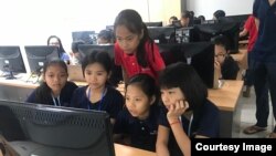 The “Cambodia Identity Product” girls team a computer at during a 12-weekend training at the Cambodia-Korea Cooperation Center. (Courtesy of Technovation Cambodia)
