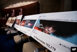 FILE - Facebook ads linked to a Russian effort to disrupt the American political process are displayed at a House Intelligence Committee hearing on Capitol Hill in Washington, Nov. 1, 2017.