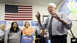 Sen. Bernie Sanders speaks to supporters during an open house at his Iowa campaign headquarters in Des Moines, Iowa.