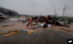 A road is littered with fallen structures in Puri district after Cyclone Fani hit the coastal eastern state of Odisha, India, May 3, 2019.