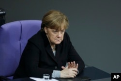 German Chancellor Angela Merkel attends a debate at the German parliament Bundestag on crime in Cologne during New Year's Eve, in Berlin, Germany, Jan. 13, 2016.