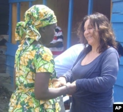 Picture here in Goma, FXBVillage founder Albina du Boisrouvray meets with a woman benefiting from the aid program. (AP PHOTO)