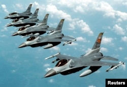 FILE- Five U.S. Air Force F-16 "Fighting Falcon" jets fly in echelon formation over the U.S. en route to an exercise in this undated photograph.