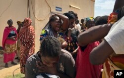 Relatives of the six slain aid workers grieve in Juba, South Sudan, March 27, 2017. Twelve aid workers have been killed so far this year in South Sudan.