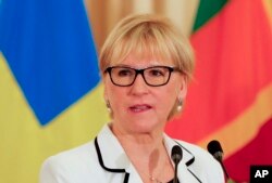 FILE - Swedish foreign minister Margot Wallstrom speaks to reporters.