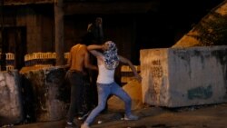 Demonstrators take part in a protest in solidarity with prisoners following the escape of six Palestinian militants from an Israeli prison, in Hebron in the Israeli-occupied West Bank, September 9, 2021.