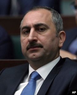 FILE - In this Feb. 6, 2016 file photo, Turkish Justice Minister Abdulhamit Gul attends a parliament session in Ankara, Turkey.