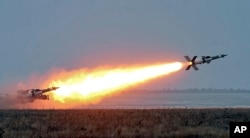 FILE - In this photo released by the Ukrainian National Security and Defense Council, an anti-aircraft rocket system is tested at a military training ground Odessa region, Ukraine, Dec. 5, 2018. The Ukrainian military has been on increased readiness as part of martial law introduced in the country in the wake of the Nov. 25, 2018, incident in the Sea of Azov, in which the Russian coast guard fired upon and seized three Ukrainian navy vessels along with their crews.