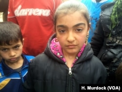 Children like this 12-year-old girl say they developed spots on their skin and respiratory problems after what appear to be homemade chemical weapons fell on their neighborhoods in eastern Mosul, Iraq, March 8, 2017.