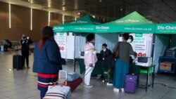 Passengers queue to get a PCR test against the coronavirus disease (COVID-19) before traveling on international flights, at O.R. Tambo International Airport in Johannesburg, South Africa, Nov. 26, 2021.
