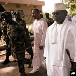Gambian President Yahya Jammeh (2nd R) leaves a polling station after casting his ballot in the presidential elections in Banjul (File)