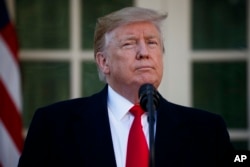 FILE - President Donald Trump announces a deal to temporarily reopen the government, in the Rose Garden of the White House, Jan. 25, 2019, in Washington.