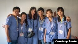 Doctors who volunteered at a medical mission organized by the Cambodian Health Professionals Association of America (CHPAA) posed in a group photo in Battambang, Cambodia, 2014. (Courtesy of CHPAA)