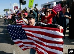 Supporters of President Donald Trump gather outside the McAllen International Airport for Trump's visit to the southern border, Jan. 10, 2019, in McAllen, Texas.