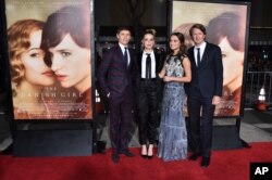 From left, Eddie Redmayne, Amber Heard, Alicia Vikander and Tom Hooper arrive at the premiere of "The Danish Girl" at Regency Village Theatre, Nov. 21, 2015, in Los Angeles, California.
