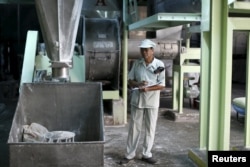 Thongdee Saenghow, a 62-year-old production supervisor, works at a rice vermicelli factory outside Bangkok, Thailand, Feb. 5, 2016.