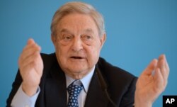 FILE - Investor George Soros warns that a British vote to leave the European Union would have grave financial consequences.