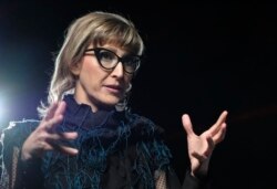 Bosnian filmmaker Jasmila Zbanic speaks and gestures during an interview with the Associated Press in the capital Sarajevo, Bosnia, Saturday, Jan. 30, 2021. (AP Photo/Kemal Softic)