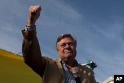 In this photo taken on April 19, 2017, Leopoldo Lopez Gil, the father of jailed Venezuelan opposition leader Leopoldo Lopez cries as he prepares to make a speech during a protest in Madrid, Spain.