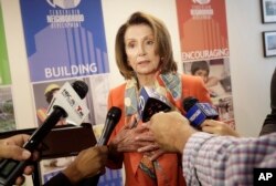 FILE - House Minority Leader Nancy Pelosi speaks to reporters after a news conference in San Francisco, California, Aug. 21, 2018.