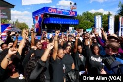 Members of the Black Lives Matter protest movement speak with reporters on the Hofstra University campus ahead of Monday night's first presidential debate (B. Allen/VOA)