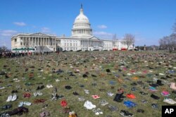 About 7,000 pairs of shoes, one for every child killed by gun violence since the Sandy Hook school shooting, were placed on the Capitol lawn by Avaaz, a U.S.-based civic organization, on Capitol Hill in Washington, March 13, 2018.