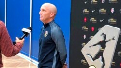 FILE - Then-North Carolina Courage coach Paul Riley is interviewed next to the National Women's Soccer League championship trophy at an event in Beaverton, Ore., Sept. 20, 2018.