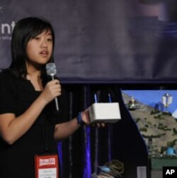 Davidson student Emily Yue makes the case for Mamohatra before a panel of judges. She argues that the city's CARE refugee center offers housing to victims of natural disaster or financial hardship.