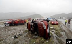 An overturned vehicle at a scene of a fatal accident, where a volunteer member of the Ventura County search and rescue team was killed, along Interstate Highway 5 south of Pyramid Lake, Calif., Feb. 2, 2019.