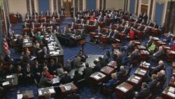 This still image taken from a US Senate webcast shows Senators voting during the impeachment trial of the US president in the Senate Chamber at the US Capitol on February 5, 2020 in Washington, DC.