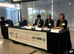 Students from the Sandra Day O'Connor College of Law at Arizona State University offer their recommendations to improve the voting access for Indians, Thursday, Jan. 11, 2018, in Phoenix, Ariz, as part of a hearing by the Native American Voting Rights Coa