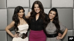 Stars of the reality show "Keeping Up with the Kardashians", Khloe Kardashian, center, Kim Kardashian, left, and Kourtney Kardashian pose for a portrait in Los Angeles, March 26, 2009.