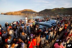 Residents line up for food after Hurricane Matthew in Anse D'Hainault, Haiti, Oct. 11, 2016.