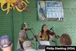 Musicians Emily Miller and her husband Jesse Milnes perform at the Augusta Heritage Music Festival in Elkins, West Virginia.