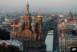 The Savior of Spilled Blood Cathedral is seen in St.Petersburg, Russia, Monday, July 29, 2013, with the Griboyedov canal at right. (AP Photo/Dmitry Lovetsky)