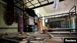 FILE - Belongings are pictured inside a hostel at the school in Dapchi in the northeastern Nigerian state of Yobe, where dozens of schoolgirls went missing after an attack on the village by Boko Haram, Feb. 23, 2018.