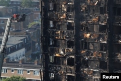 Damage is seen to a tower block which was destroyed in a fire disaster, in north Kensington, West London, Britain June 15, 2017.