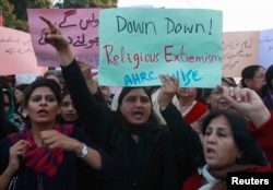 FILE - Women chant slogans condemning Islamist terrorism during an anti-terror rally in Lahore, Pakistan, Jan. 16, 2015. Experts say 13 of the approximately 60 U.S.-designated global terrorist organizations are based in Pakistan.