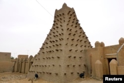 FILE - A traditional mud structure stands in the Malian city of Timbuktu, May 15, 2012.