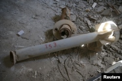 Remaining missile fragments from attacks in 2013 are shown in the Ghouta town of Ain Tarma, Syria, April 7, 2017.
