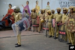 Policemen stand guard near the state secretariat anticipating protests following reports of two women entering the Sabarimala temple in Thiruvananthapuram, Kerala, India, Jan. 2, 2019