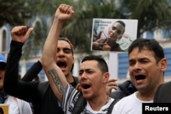 Demonstrators protest against Venezuela's President Nicolas Maduro's government during a meeting of foreign ministers and representatives from across the Americas to discuss issues related to the Venezuelan crisis in Lima, Peru. Aug. 8, 2017.