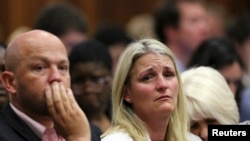 The family members of Reeva Steenkamp react as the verdict is handed down, Sept. 12, 2014.