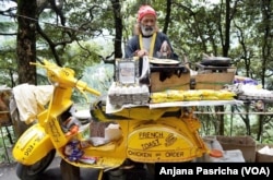 FILE - The bright yellow Maggi noodles were among the popular snacks sold by this food vendor in the hill town of Dalhousie, India, June 9, 2015.