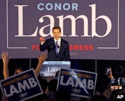 Conor Lamb, the Democratic candidate for the March 13 special election in Pennsylvania's 18th Congressional District celebrates with his supporters at his election night party in Canonsburg, Pa., early Wednesday, March 14, 2018.