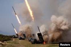 North Korean military conducts a "strike drill" for multiple launchers and tactical guided weapon into the East Sea during a military drill in North Korea, in this May 4, 2019, photo supplied by the Korean Central News Agency (KCNA).